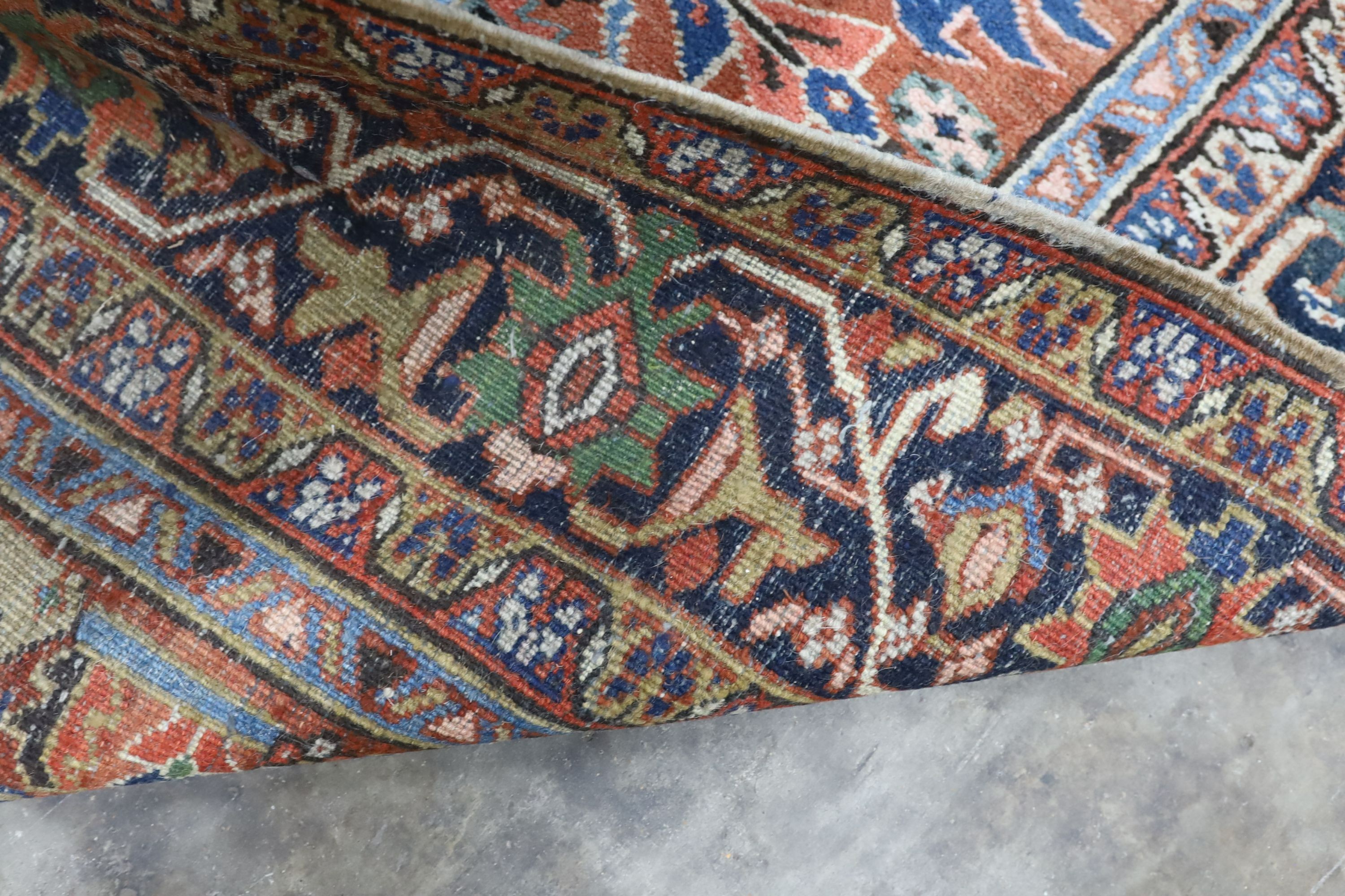 A Caucasian red ground carpet, 390 x 285cm